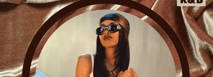 Aaliyah in sunglasses framed by an arch, album artwork