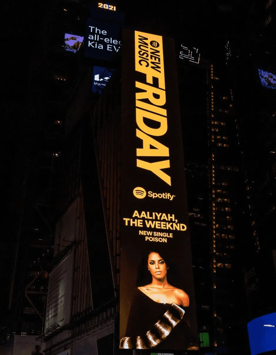 Vertical Aaliyah billboard reading Listen to One in a Million
