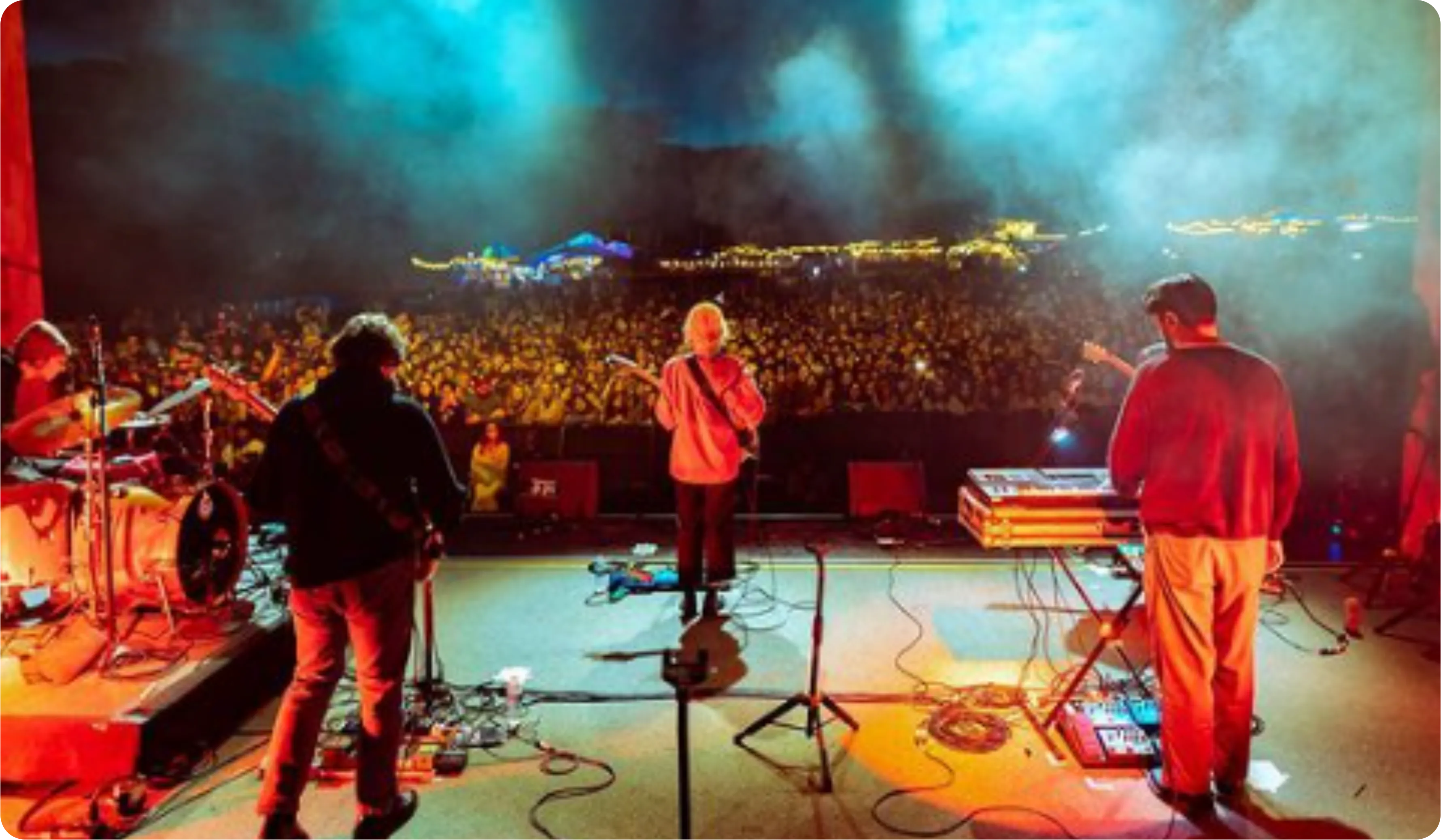 Artists performing on the Shabang stage under red light